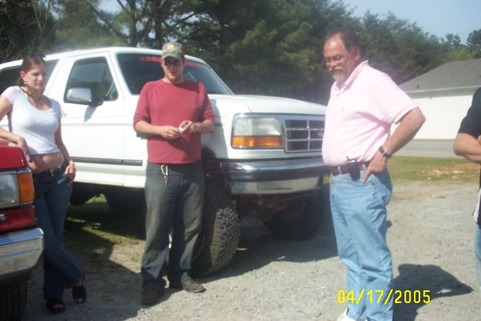 White Ford F-Series truck with chrome grille and headlights, seen from a 3/4 front angle
