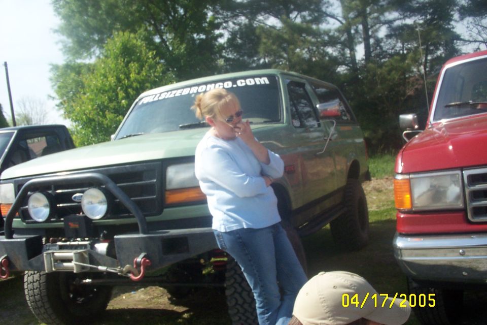 Green SUV with winch and bull bar, text on windshield reads FULLSIZEBRONCO.COM