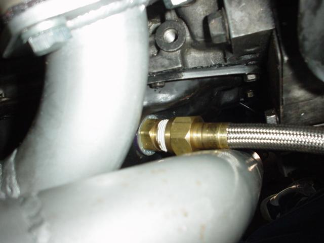 Braided hose connected to engine part