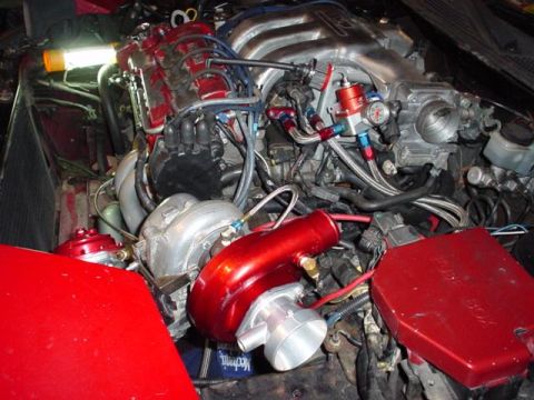 1996 Ford Probe - Customized engine bay a turbocharger and aftermarket fuel system components.