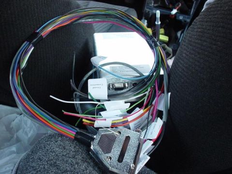 1996 Ford Probe - A complex wiring harness and electronic module are laid out, with numerous wires labeled for connection.