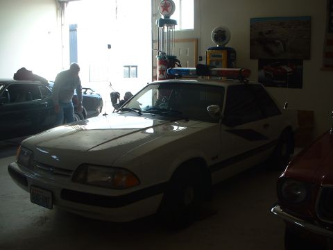 1999 Ford Crown Victoria - 1987 SSP Mustang. Restored back as a Washington State Patrol car.