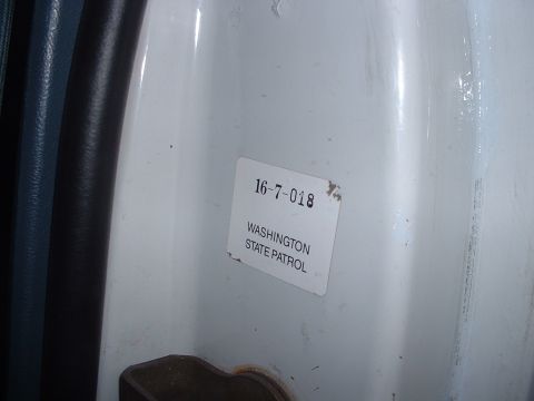 1999 Ford Crown Victoria - A sticker indicates this part of a vehicle belongs to the Washington State Patrol.
