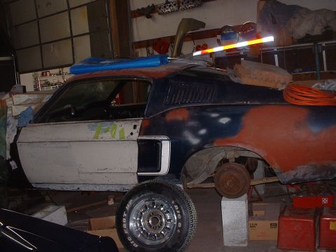 1999 Ford Crown Victoria - This 1967 Ford Mustang fastback is in a state of restoration, showing primer and rust.