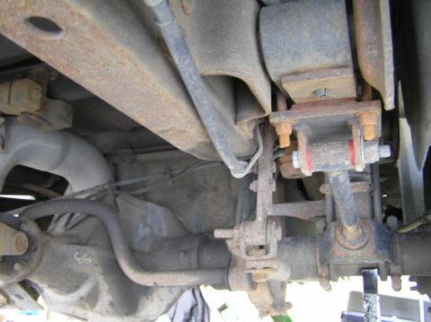 2000 Ford Excursion - Close-up view of the undercarriage, showing various suspension components and the rear differential.