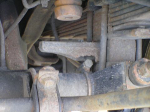 2000 Ford Excursion - Undercarriage view showing suspension parts like leaf springs and U-bolts.