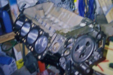 1994 Ford F-150 - This is a close-up view of an engine block, showing the cylinder bores and some attached components.