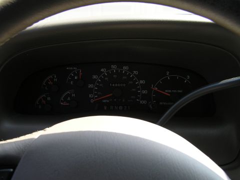 2000 Ford Excursion - The odometer reads 140,000 miles on this vehicle's dashboard, which also displays fuel and temperature gauges.