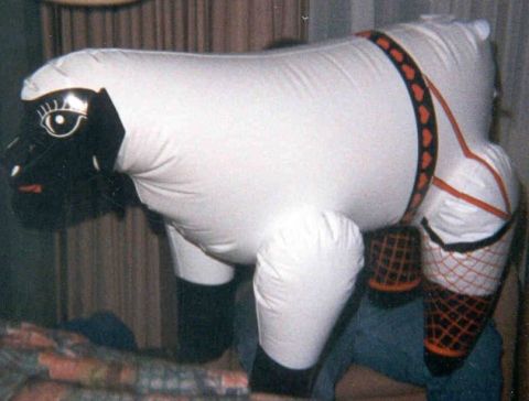 1988 Ford Bronco - This inflatable sheep toy features a black face with large eyes and a decorative harness with a heart pattern.