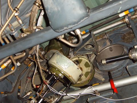 1988 Ford Bronco - Close-up view of intricate machinery and plumbing within an aircraft's interior.