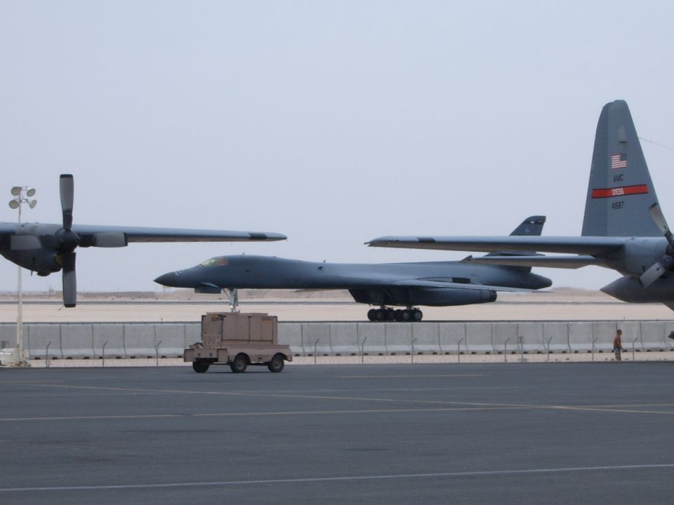 B-1 bomber and C-130 aircraft on tarmac