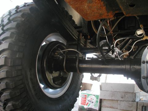 1994 Ford Bronco - Rear axle and suspension components, with a visible box of Castrol GTX oil.
