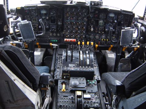 1988 Ford Bronco - The complex dashboard and controls of an aircraft cockpit are shown in this image.