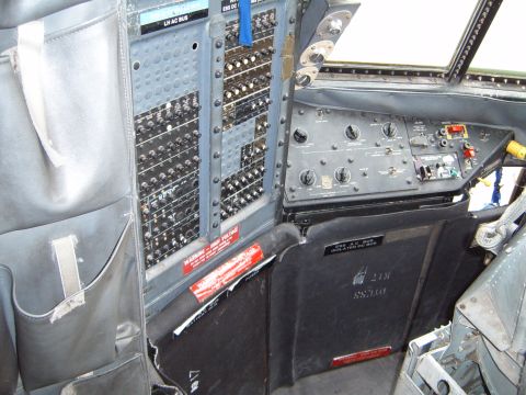 1988 Ford Bronco - The interior of an aircraft cockpit displays numerous switches, dials, and control panels.