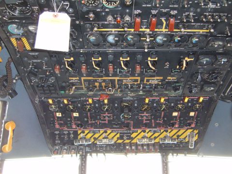1988 Ford Bronco - Close-up of an aircraft's complex control panel, filled with numerous gauges and switches.