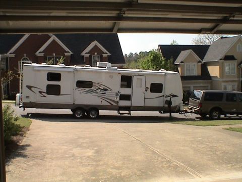 2004 Ford Excursion - Side View in front of the house. This definately won't fit in the garage!