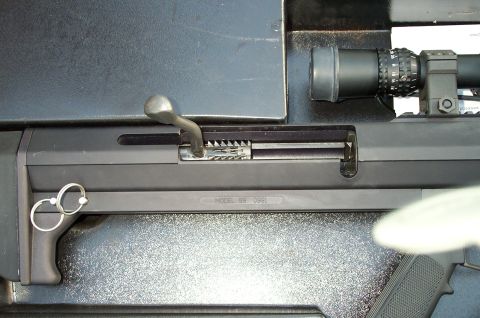 1998 Ford Crown Victoria - Sniper rifle detail showing the bolt action mechanism and scope mount. Text indicates 'MODEL 99 0991'.