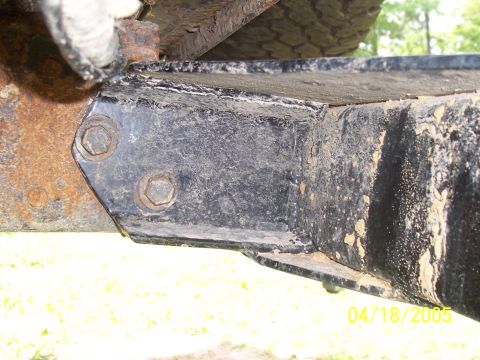 1987 Ford Bronco - Underside close-up of a vehicle frame rail and crossmember joint secured with two hex bolts, timestamped 04/18/2005.