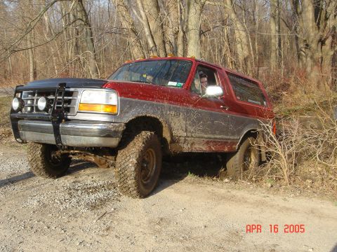1995 Ford Bronco - This 1995 Ford Bronco appears to be stuck in the mud while navigating an off-road trail.
