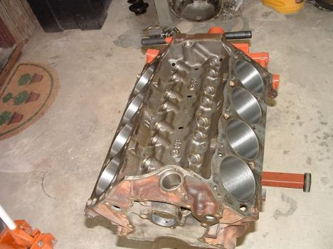 1985 Ford LTD Crown Victoria - Engine block on an orange stand, ready for a new build. The registry claims it is a 1985 Ford Crown Victoria LTD, but this is unconfirmed.
