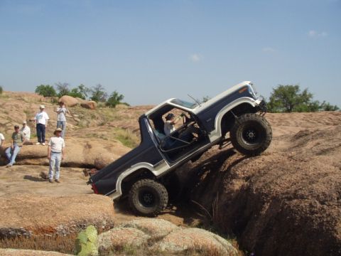 1986 Ford Bronco - A 1986 Ford Bronco navigates a challenging rocky incline at Katemcy Rocks.