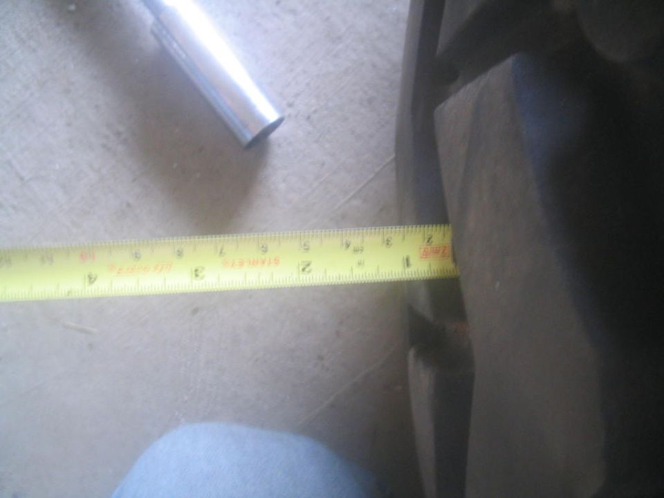 measuring tire width with a tape measure