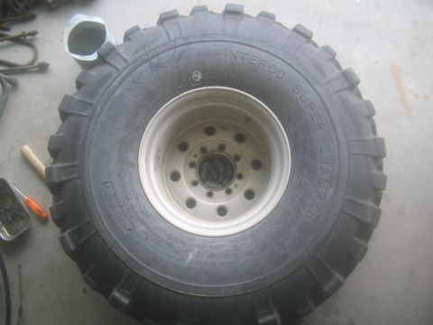 1983 Ford F-250 - A close-up view of a large off-road tire and wheel assembly.