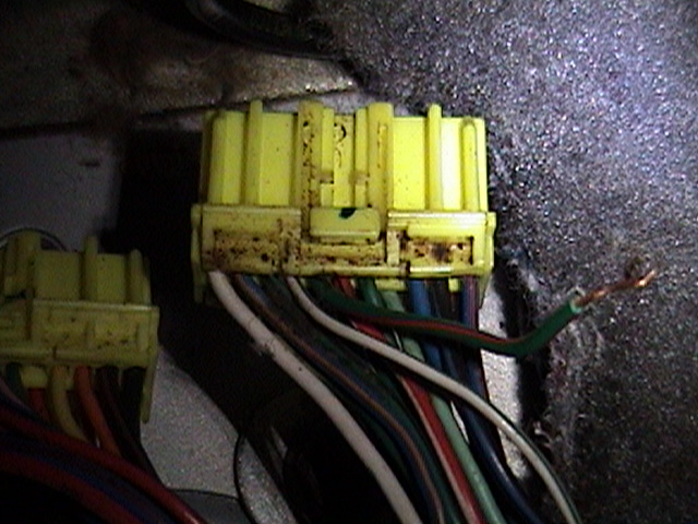 Yellow automotive wiring harness connectors with multicolored wires