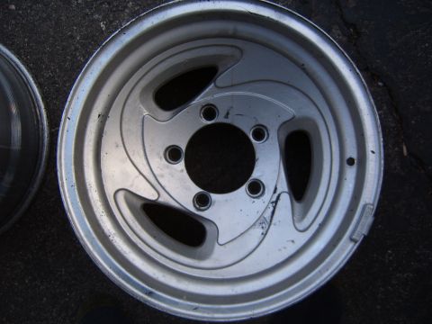 1993 Ford Bronco - A single silver alloy wheel is shown, with another wheel partially visible to the left.