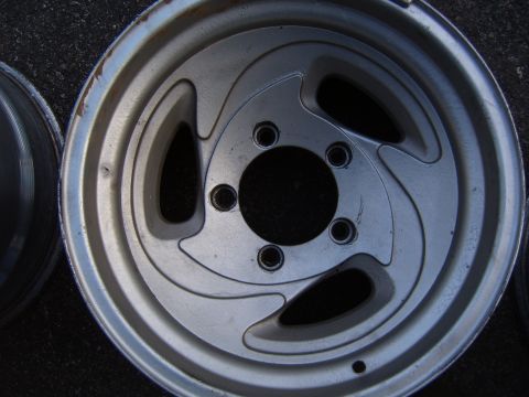 1993 Ford Bronco - A single alloy wheel is shown, with another wheel partially visible to the left.