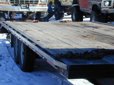 1979 Ford F-150 - A 1979 Ford F-150 with prominent grille and large tires is seen on a trailer.