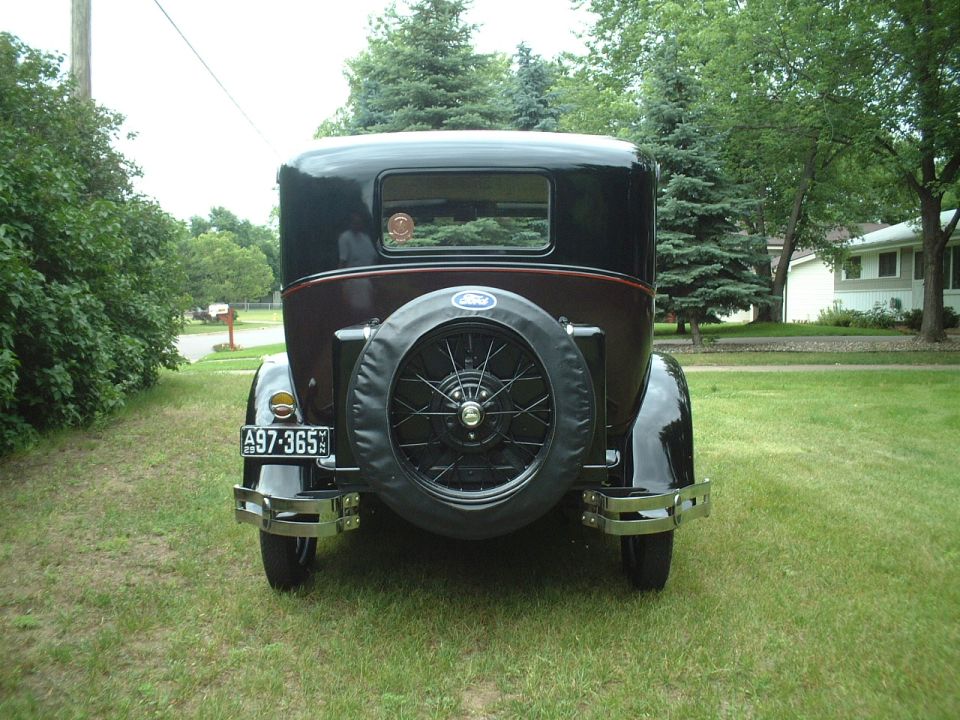 1929 Ford Model A sedan, rear view, with spare tire mounted on the back