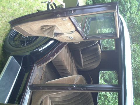 1929 Ford Model A - The plush interior of a 1929 Ford Model A coupe shows its original upholstery and door panels.