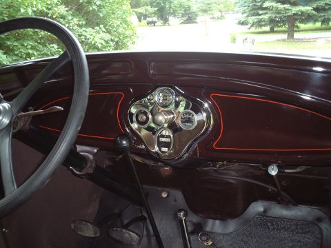 1929 Ford Model A - Interior view of a 1929 Ford Model A dashboard, showing the steering wheel and gauges.