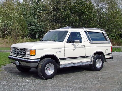 1988 Ford Bronco - This 1988 Ford Bronco is shown in a three-quarter front view, highlighting its classic SUV design.