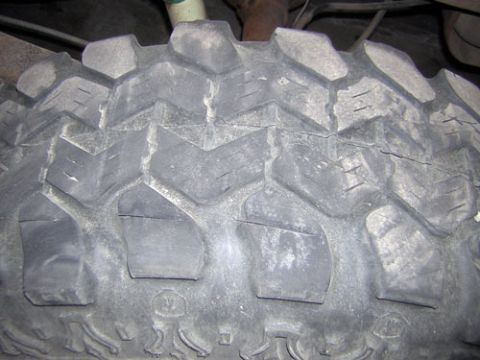 1995 Ford Bronco - The aggressive tread pattern of an off-road tire is shown in this close-up view.