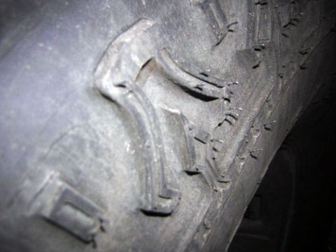 1995 Ford Bronco - Detail of a tire's tread pattern, showing the aggressive lug design.