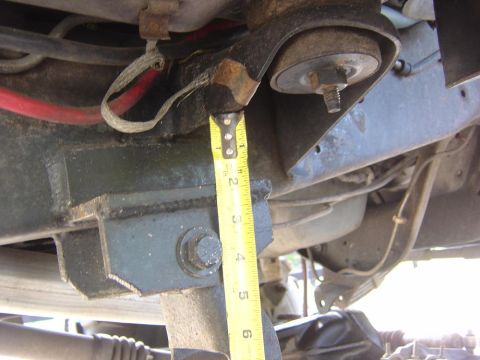 1993 Ford Bronco - Measuring suspension components on a vehicle frame.