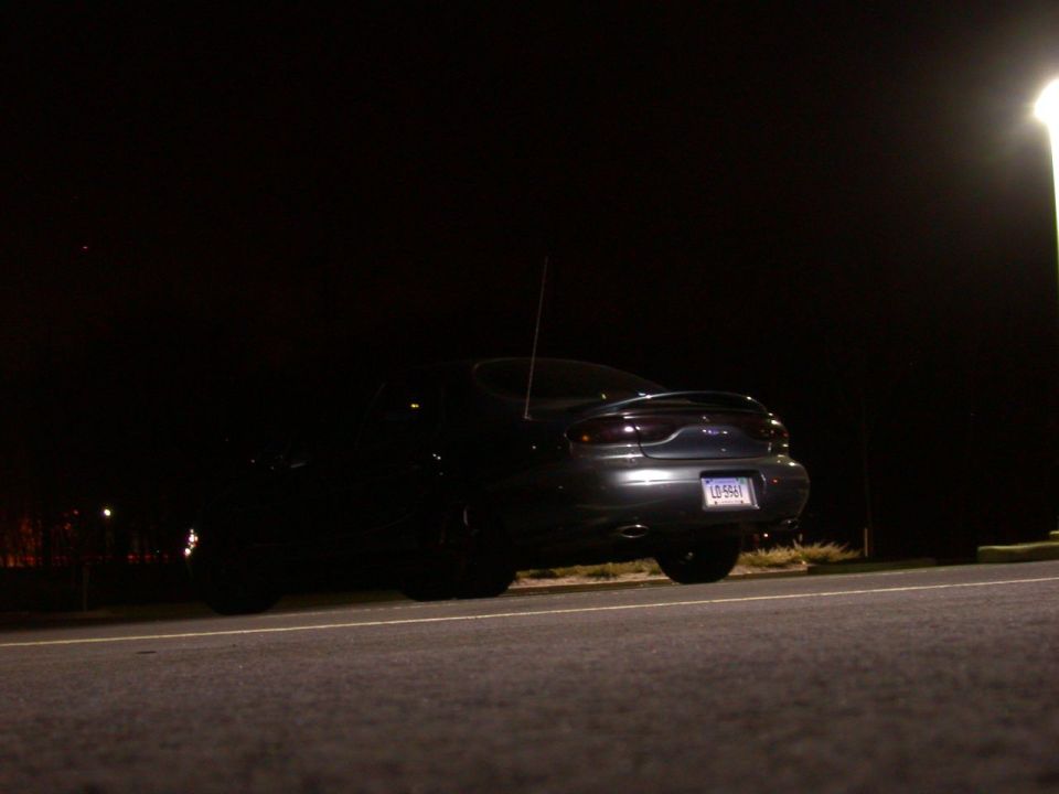 Car parked at night, rear view. License plate reads L2 5961