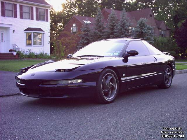 1997 Ford Probe parked in front of a house