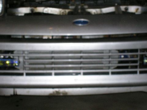 1990 Ford Probe - Close-up view of a vehicle's front grille and emblem.
