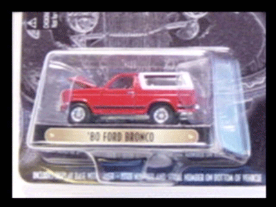 1990 Ford Bronco - red '80 Ford Bronco diecast toy in clear blister packaging with a gold nameplate reading '80 FORD BRONCO.