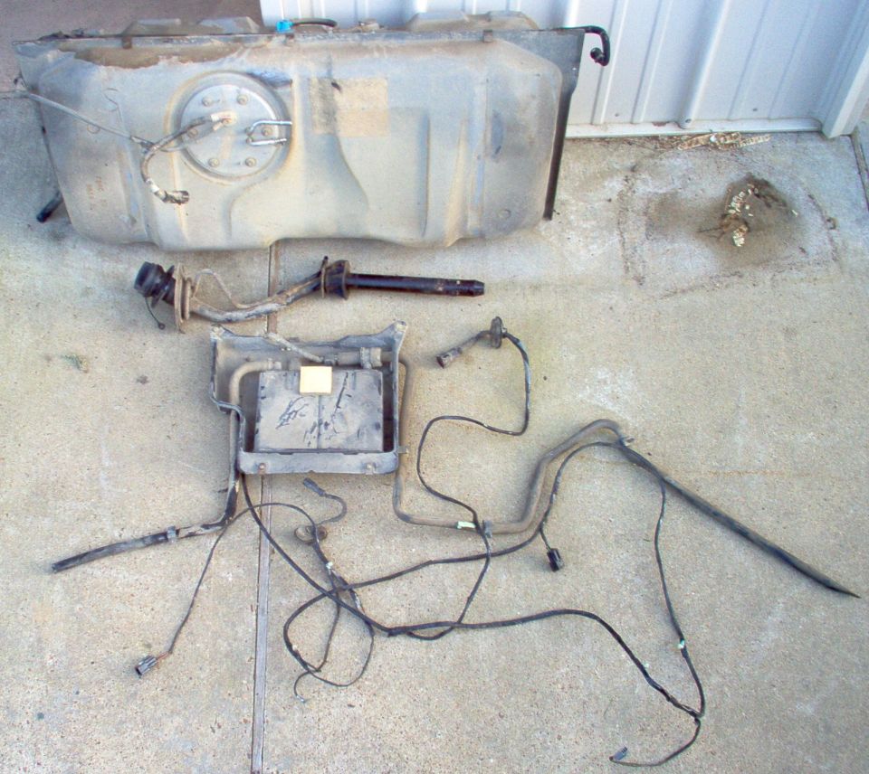 I pulled this from a '98 P71.  It was nearly full of gas, so I figured it would be fairly clean inside.  I was wrong.  But I did get all the emissions stuff I was after, including the CANV, FTP, & enough wiring to get me into my trunk for splicing.