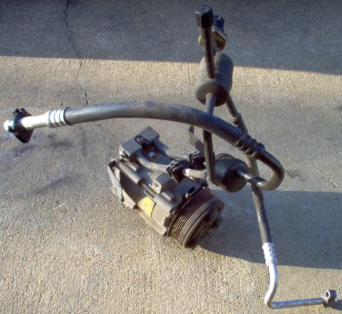 1994 Ford Crown Victoria - Compressor from 2000 Grand Marquis was still holding full charge when removed. Pressure switch not included.