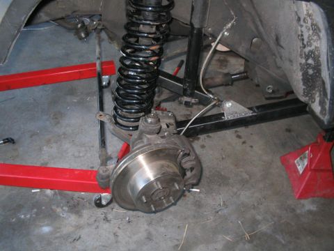 1994 Jeep Cherokee - This image shows the suspension and brake components of a vehicle, likely undergoing maintenance or repair.