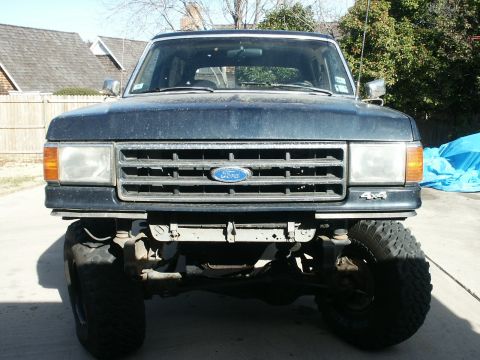 1991 Ford Bronco - This Ford truck features a distinctive grille and 4x4 badging, indicating it's likely from the late 1980s.