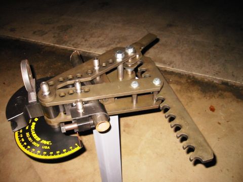 1985 Ford Bronco - A metal tube bender is shown with its various components and markings.