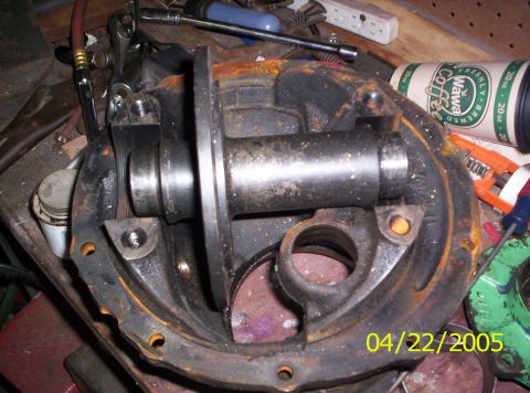 1985 Ford Bronco - A differential housing sits on a workbench with tools and a coffee cup nearby, dated 04/22/2005.