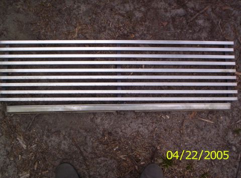1985 Ford Bronco - A vehicle grille is shown lying on the ground, with a date stamp of 04/22/2005.