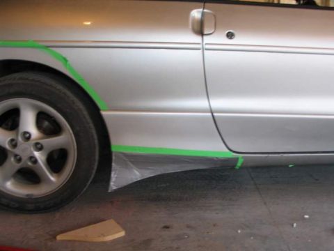 1993 Ford Probe - Preparing the side skirt area for modification on a 1993 Ford Probe.